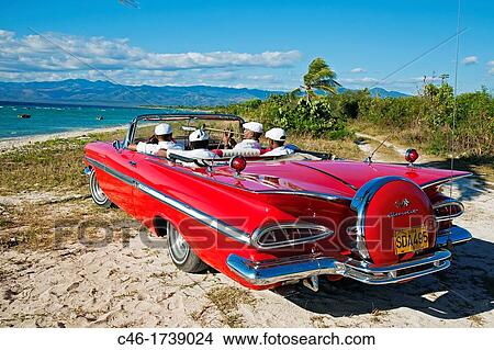 Ancon beach, Classic car and music band, Trinidad city, Sancti Spiritus Province, Cuba. View Large Photo Image Picture - Ancon beach, Classic car and music band, Trinidad city, Sancti Spiritus Province, Cuba.. Fotosearch