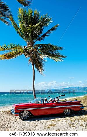 Ancon beach, Classic car and music band, Trinidad city, Sancti Spiritus Province, Cuba. View Large Photo Image Stock Image - Ancon beach, Classic car and music band, Trinidad city, Sancti Spiritus Province, Cuba.. Fotosearch