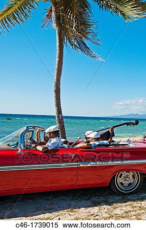 Ancon beach, Classic car and music band, Trinidad city, Sancti Spiritus Province, Cuba. View Large Photo Image Stock Photography - Ancon beach, Classic car and music band, Trinidad city, Sancti Spiritus Province, Cuba.. Fotosearch