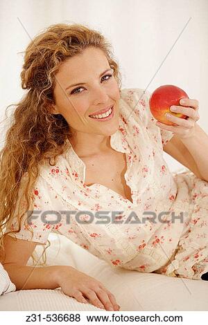 Angela, Apple, Leaning, Smiling View Large Photo Image Stock Photo - Angela, Apple, Leaning, Smiling. Fotosearch