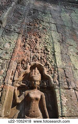 Stock Photo - Angkor (Cambodia): apsara relief at the Ta Prohm. Fotosearch