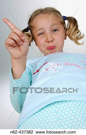 Stock Image - Angry blond child says not with the finger.. Fotosearch