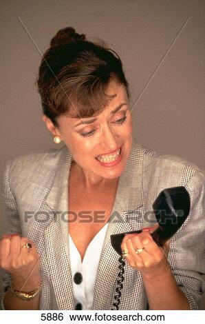 Angry business woman on phone View Large Photo Image Stock Photograph - Angry business woman on phone. Fotosearch