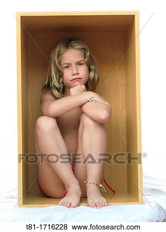 Angry girl in a box View Large Photo Image Stock Photo - Angry girl in a box. Fotosearch