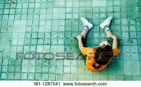 Angry girl, sitting on the ground. View Large Photo Image Stock Image - Angry girl, sitting on the ground.. Fotosearch