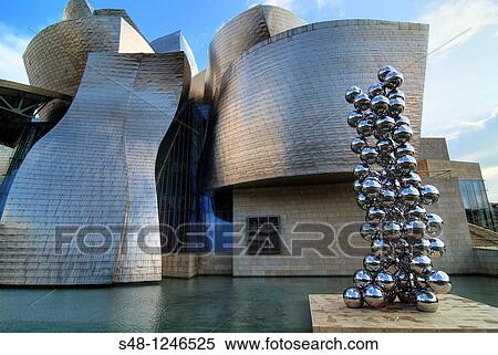 Anish Kapoor sculpture at the Guggenheim Museum in Bilbao Vizcaya Spain Basque Country View Large Photo Image Stock Photography - Anish Kapoor sculpture at the Guggenheim Museum in Bilbao Vizcaya Spain Basque Country. Fotosearch