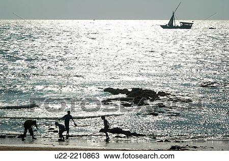 Anjuna, Goa, India: Indian tourists at the beach View Large Photo Image Stock Image - Anjuna, Goa, India: Indian tourists at the beach. Fotosearch