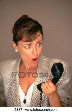 Annoyed business woman on phone View Large Photo Image Stock Photo - Annoyed business woman on phone. Fotosearch