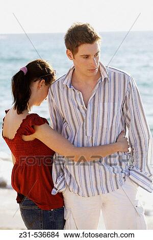 Ansgard, Birgit, Beach, Embracing, Hands in pockets View Large Photo Image Picture - Ansgard, Birgit, Beach, Embracing, Hands in pockets. Fotosearch