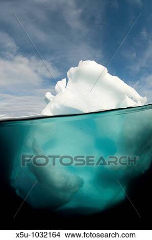 Picture - Antarctic peninsula iceberg Pleneau, split shot showing the large proportion of the berg that is underwater. Fotosearch