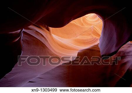 Antelope Canyon. Probably the most visited and photographed slot canyon in the South West. The light enter into the narrow canyon walls creating beautiful colours in the sandstone rock. Upper Antelope Canyon, Navajo Nation, Arizona, USA. View Large Photo Image Stock Photo - Antelope Canyon. Probably the most visited and photographed slot canyon in the South West. The light enter into the narrow canyon walls creating beautiful colours in the sandstone rock. Upper Antelope Canyon, Navajo Nation, Arizona, USA.. Fotosearch