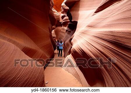 Antelope Canyon Probably the most visited and photographed slot canyon in the Southwest The light enter into the narrow canyon walls creating beautiful colours in the sandstone rock Lower Antelope Canyon, Navajo Nation, Arizona, USA View Large Photo Image Stock Photograph - Antelope Canyon Probably the most visited and photographed slot canyon in the Southwest The light enter into the narrow canyon walls creating beautiful colours in the sandstone rock Lower Antelope Canyon, Navajo Nation, Arizona, USA. Fotosearch