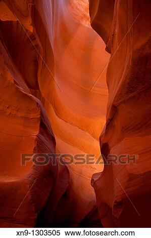 Antelope Canyon. Probably the most visited and photographed slot canyon in the South West. The light enter into the narrow canyon walls creating beautiful colours in the sandstone rock. Upper Antelope Canyon, Navajo Nation, Arizona, USA. View Large Photo Image Stock Photography - Antelope Canyon. Probably the most visited and photographed slot canyon in the South West. The light enter into the narrow canyon walls creating beautiful colours in the sandstone rock. Upper Antelope Canyon, Navajo Nation, Arizona, USA.. Fotosearch