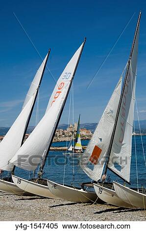Stock Photography - Antibes, French Riviera, beach and catamarans. Fotosearch