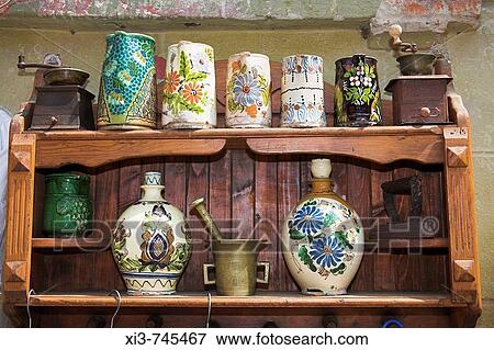 Antique pottery items for sale on shelving outside an antique shop, Sighisoara, Transylvania, Romania View Large Photo Image Stock Photo - Antique pottery items for sale on shelving outside an antique shop, Sighisoara, Transylvania, Romania. Fotosearch