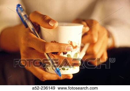 Anxious lady holding coffee. View Large Photo Image Stock Photo - Anxious lady holding coffee.. Fotosearch