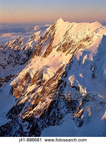 Aoraki / Mount Cook Hooker and South faces and Grand Traverse at sunset aerial view New Zealand View Large Photo Image Stock Image - Aoraki / Mount Cook Hooker and South faces and Grand Traverse at sunset aerial view New Zealand. Fotosearch