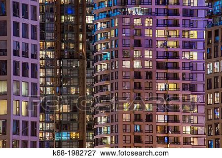 Stock Photo - apartment buidings on the north shore of False Creek at night, Vancouver, BC, Canada.. Fotosearch