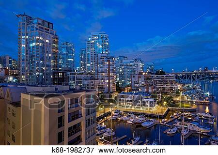 apartment buildings at night on the north shore of False Creek, Vancouver, BC, Canada. View Large Photo Image Stock Photo - apartment buildings at night on the north shore of False Creek, Vancouver, BC, Canada.. Fotosearch
