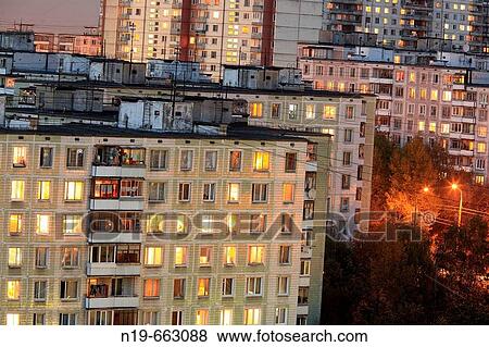 Apartment buildings in the evening with lights in windows, Moscow, Russia View Large Photo Image Stock Photo - Apartment buildings in the evening with lights in windows, Moscow, Russia. Fotosearch