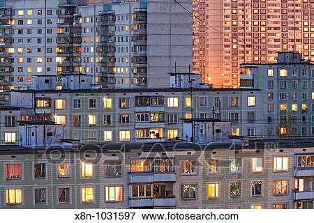 Apartment buildings in the evening with lights in windows, Moscow, Russia View Large Photo Image Stock Photo - Apartment buildings in the evening with lights in windows, Moscow, Russia. Fotosearch