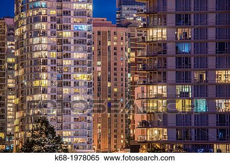 Stock Photography - apartment towers at night on False Creek, Vancouver, BC, Canada.. Fotosearch