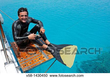 Stock Image - Apneist and dolphin specialist Frederic Chotard getting ready for snorkeling, Red Sea, Marsa Alam region, Egypt. Fotosearch