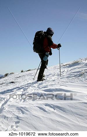 Stock Image - Appalachian Trail - Hikers make their way along the Franconia Ridge Trail during the winter months Located in the White Mountains, New Hampshire USA Notes:. Fotosearch