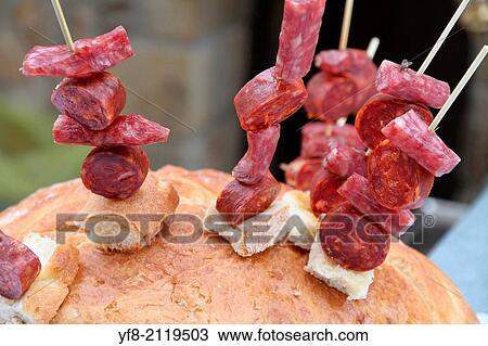 Stock Image - Appetizer on bread, Flea market, Puertomingalvo village, Teruel, Aragon, Spain.. Fotosearch