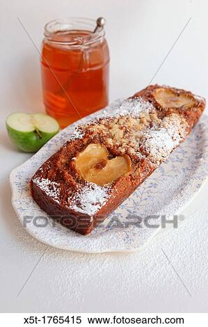 Apple Cake and Honey Tradditionaly eaten during Rosh Hashana the Jewish New Year View Large Photo Image Stock Photography - Apple Cake and Honey Tradditionaly eaten during Rosh Hashana the Jewish New Year. Fotosearch