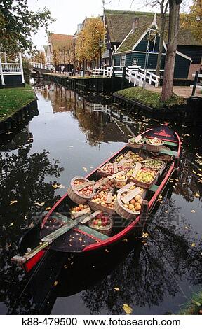 Stock Image - Apples for sale on canal, Enkhuizen. Holland. Fotosearch