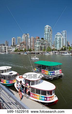 AQUA BUSES GRANVILLE ISLAND QUAY FALSE CREEK VANCOUVER SKYLINE BRITISH COLUMBIA CANADA View Large Photo Image Stock Photograph - AQUA BUSES GRANVILLE ISLAND QUAY FALSE CREEK VANCOUVER SKYLINE BRITISH COLUMBIA CANADA. Fotosearch