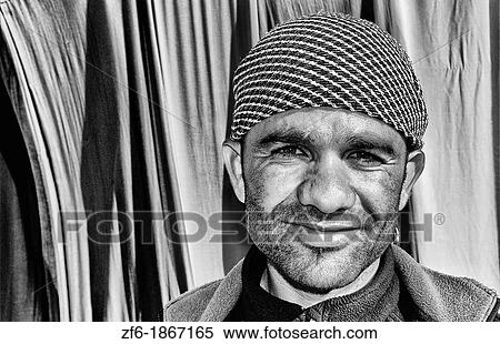 Arab man portrait with fabrics in oasis Town of Chebika near Mides and Tamerza Tunisia in Africa View Large Photo Image Stock Photography - Arab man portrait with fabrics in oasis Town of Chebika near Mides and Tamerza Tunisia in Africa. Fotosearch