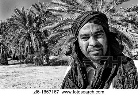 Arab man with turban in oasis Town with plam trees of Chebika near Mides and Tamerza Tunisia in Africa View Large Photo Image Stock Photo - Arab man with turban in oasis Town with plam trees of Chebika near Mides and Tamerza Tunisia in Africa. Fotosearch