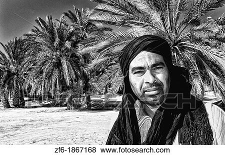 Arab man with turban in oasis Town with plam trees of Chebika near Mides and Tamerza Tunisia in Africa View Large Photo Image Stock Photo - Arab man with turban in oasis Town with plam trees of Chebika near Mides and Tamerza Tunisia in Africa. Fotosearch