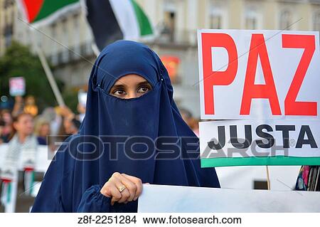 Arab woman demanding peace and protesting against Israeli attacks in the Gaza Strip during a demonstration in Madrid on July 18, 2014. Madrid. Spain. View Large Photo Image Picture - Arab woman demanding peace and protesting against Israeli attacks in the Gaza Strip during a demonstration in Madrid on July 18, 2014. Madrid. Spain.. Fotosearch