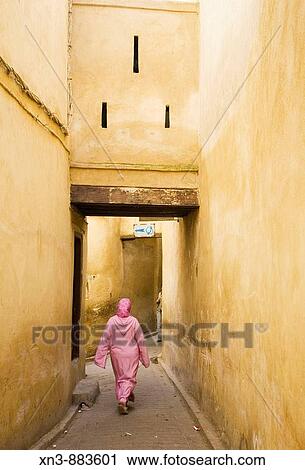 Arab woman walking in the medina of Fez in Morocco. View Large Photo Image Stock Image - Arab woman walking in the medina of Fez in Morocco.. Fotosearch