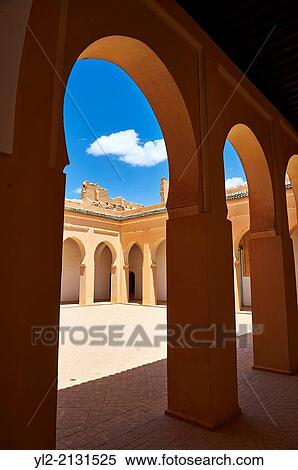 Stock Photography - Arabesque courtyard of the Alaouite Ksar Fida built by Moulay Isma? l the second ruler of the Moroccan Alaouite dynasty ( reigned 1672-1727 ). Residence of the Khalifa or Caid of Tafilalet until 1965. Tafilalet Oasis, near Rissini, Morocco.. Fotosearch