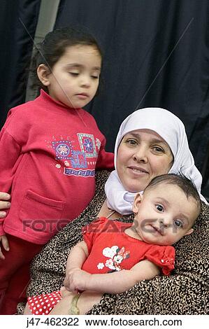 Arabic mother with her 3 year old daughter and baby girl. View Large Photo Image Stock Image - Arabic mother with her 3 year old daughter and baby girl.. Fotosearch