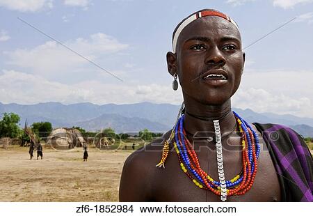Picture - Arbore Tribe Ethiopia Africa Erbore tribal village Lower Omo Valley young boy in dress and jewelry 27. Fotosearch