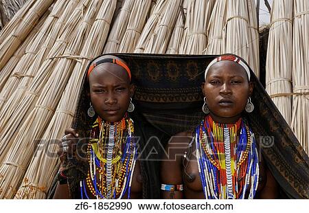 Arbore Tribe Ethiopia Africa Erbore tribal village Lower Omo Valley young girls with colorful dress 27 View Large Photo Image Stock Image - Arbore Tribe Ethiopia Africa Erbore tribal village Lower Omo Valley young girls with colorful dress 27. Fotosearch