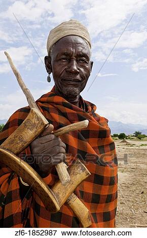 Stock Photo - Arbore Tribe Ethiopia Africa Erbore tribal village Lower Omo Valley old man in red portrait traditional 27. Fotosearch
