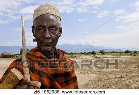 Stock Photo - Arbore Tribe Ethiopia Africa Erbore tribal village Lower Omo Valley old man in red portrait traditional 27. Fotosearch