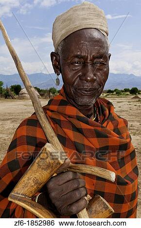 Stock Photograph - Arbore Tribe Ethiopia Africa Erbore tribal village Lower Omo Valley old man in red portrait traditional 27. Fotosearch