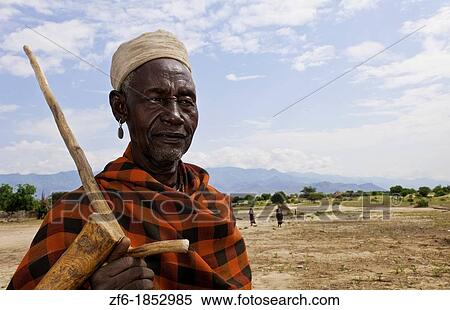 Arbore Tribe Ethiopia Africa Erbore tribal village Lower Omo Valley old man in red portrait traditional 27 View Large Photo Image Stock Photography - Arbore Tribe Ethiopia Africa Erbore tribal village Lower Omo Valley old man in red portrait traditional 27. Fotosearch