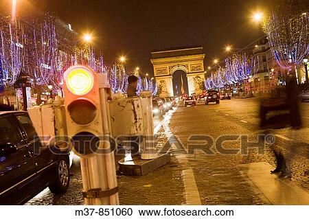 Stock Image - Arch de Triomphe and Rue des Champs Elysees during Christmas time, Paris, France. Fotosearch