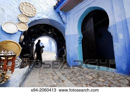 Stock Image - Arch in a street of the medina of Chefchaouen, Morocco.. Fotosearch