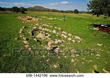Stock Photograph - Archaeological navetiformes structures of s? Hospitalet Vell 1000-900 BC Balearic Islands Mallorca Spain. Fotosearch