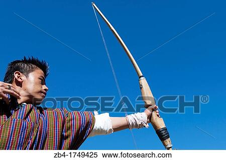 Archery, Bhutan's national sport, Bumthang, Bhutan, Asia. View Large Photo Image Stock Photography - Archery, Bhutan's national sport, Bumthang, Bhutan, Asia.. Fotosearch