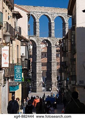 Picture - Arches and pillars built with granite blocks without mortar in the section of the Roman aqueduct in Segovia Square Azoguejo - Castilla-Le? n - Spain. Fotosearch